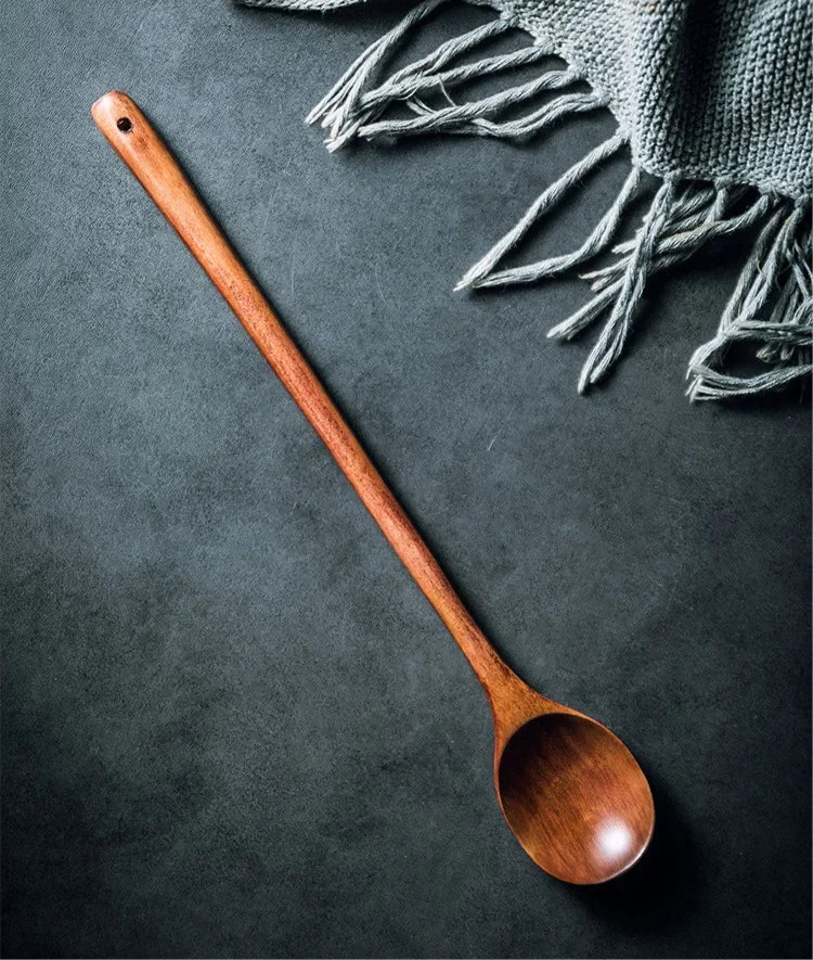 Long wooden stirring spoon