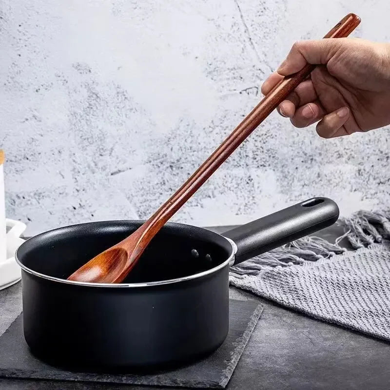 Long wooden stirring spoon